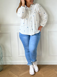 Off-white and blue shirt: Sania
