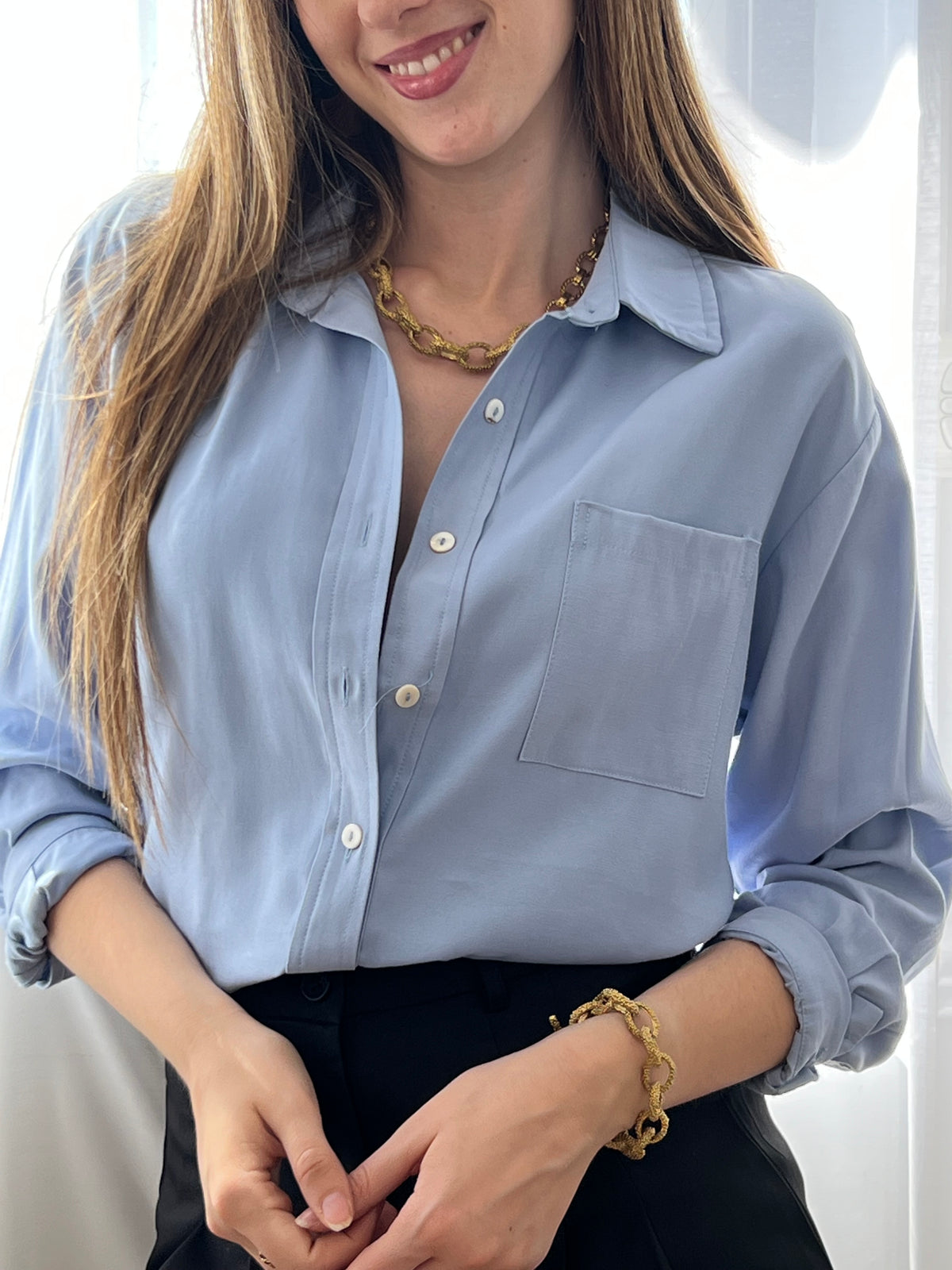 Blue shirt: Sana
