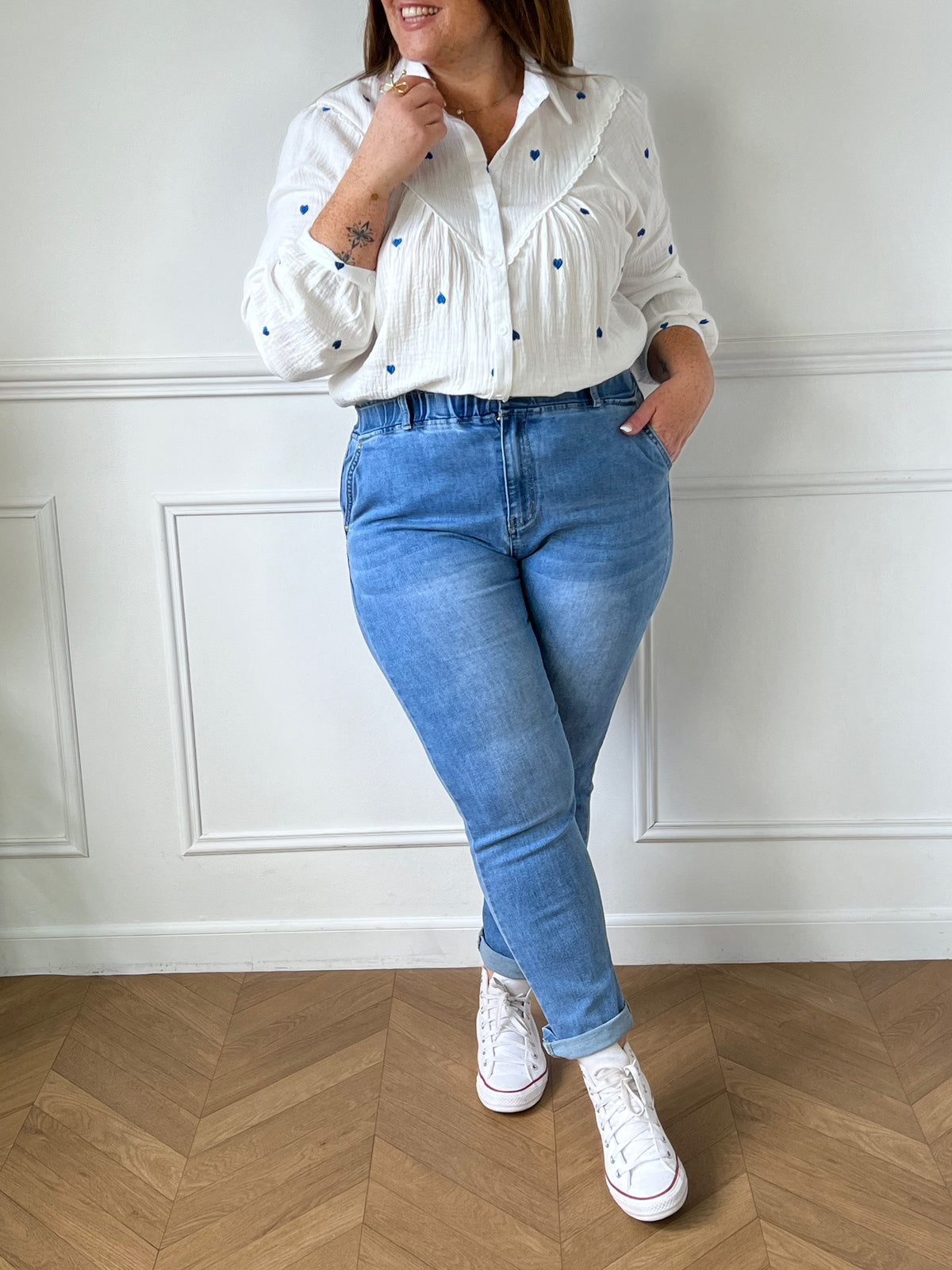 Off-white and blue shirt: Sania
