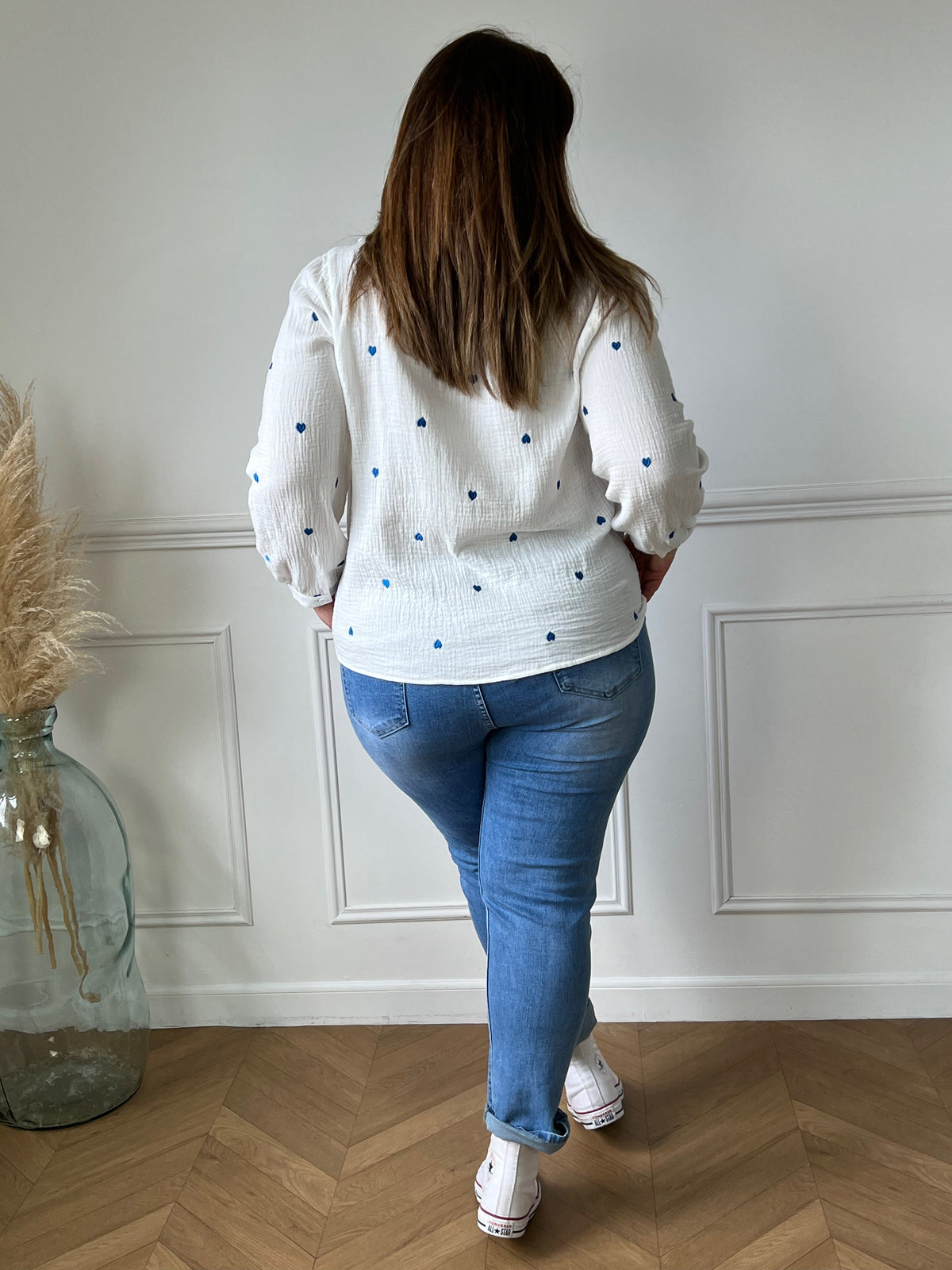 Off-white and blue shirt: Sania