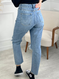 JEAN TROUÉ BLEU CLAIR FEMME Jean Fitted straight Fermeture boutons et zip 2 poches devant et derrière Effet déchiré et troué Couleur : bleu Composition: 100% Coton